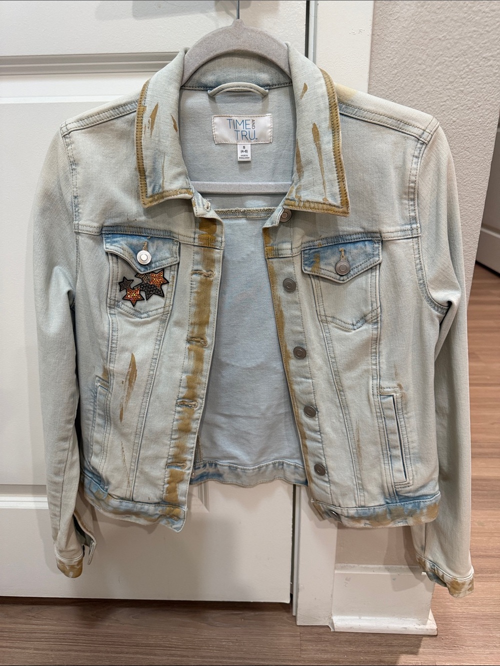 Time and Tru Light Wash Denim Jacket with Brown Paint Streaks and Star Patches